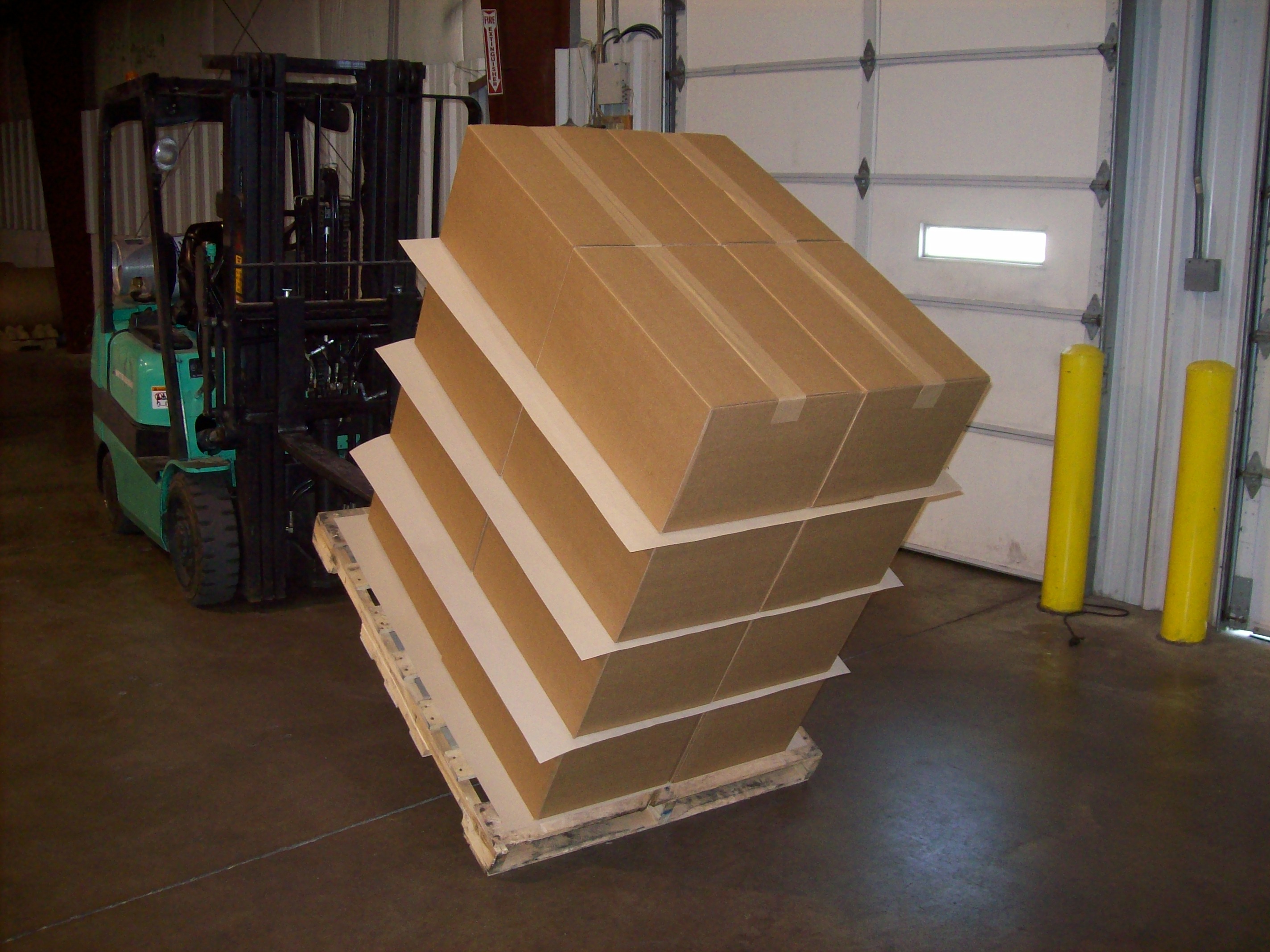 A pallet stabilized with anti-slip sheets between layers of boxes.